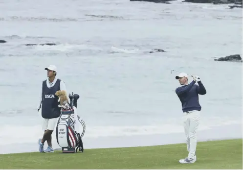  ??  ?? 0 Rory Mcilroy plays his second shot at the tenth hole during the first round of the US Open at Pebble Beach in California.