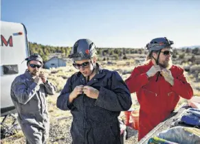  ??  ?? Kirk Silas, from left, a bat biologist; Catherine Haase, a postdoctor­al researcher from Montana State University; and Nate Fuller, a postdoctor­al biologist from Texas Tech.