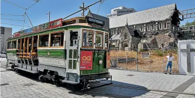  ??  ?? The Christchur­ch tram passes the earthquake-damaged Christ Church Cathedral. What worked in Christchur­ch was the combinatio­n of top down and bottom up approaches being joined up.