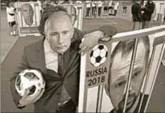  ?? REUTERS ?? A Reporter Without Borders activist wears a Vladimir Putin mask at a protest against curbing the freedom of the Press in Paris, June 13