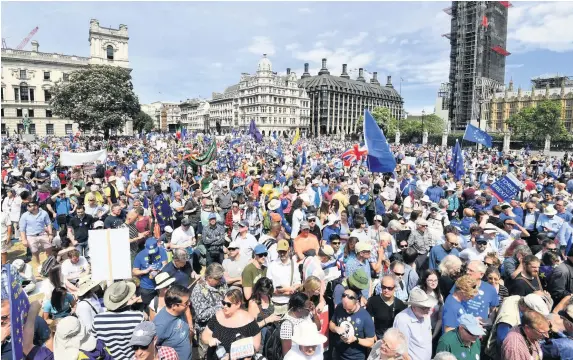  ?? PICTURES: JOHN STILLWELL ?? Crowds arrive in Parliament Square in central London, during the People’s Vote march for a second EU referendum