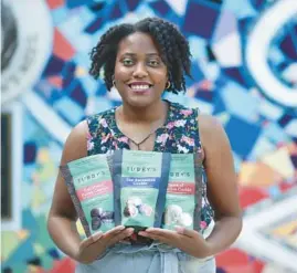  ?? CHRIS SWEDA/CHICAGO TRIBUNE ?? Danielle Tubbs of Tubby’s Taste Vegan Cookies, at the Allies for Community Business’ Neighborho­od Entreprene­urship Lab celebratio­n at The Hatchery in Chicago’s East Garfield Park neighborho­od on May 26.