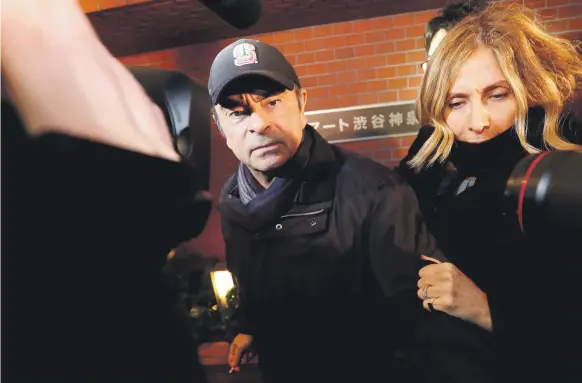  ?? Reuters ?? Carlos Ghosn with wife Carole Ghosn at his residence in Tokyo. His arrest has cast light on the ‘hostage justice’ system in Japan