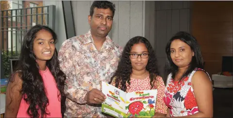  ??  ?? Young author Sennuri Wickramara­tne launching her new book ‘The Lost Creatures’ at Gorey Library, pictured with her sister Swetha and parents Nalin and Duleeka.