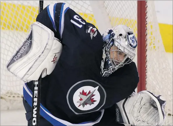  ?? — GETTY IMAGES FILES ?? Ondrej Pavelec hasn’t been giving the Winnipeg Jets the type of goaltendin­g they needed to build on the success they had last season. The Jets, 29th in the NHL standings, play host to the Vancouver Canucks tonight in a battle of non-playoff teams.