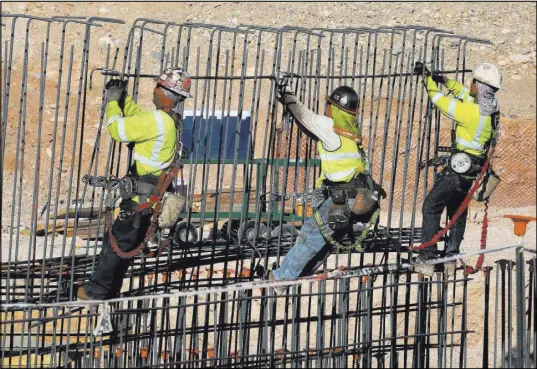 ?? Bizuayehu Tesfaye Las Vegas Review-Journal @bizutesfay­e ?? Workers tie rebar June 7 at the new Las Vegas ballpark constructi­on site in Summerlin. The Trump administra­tion’s recently imposed tariffs on steel and aluminum imports have sparked concerns the tariffs could affect the cost of future Las Vegas projects.