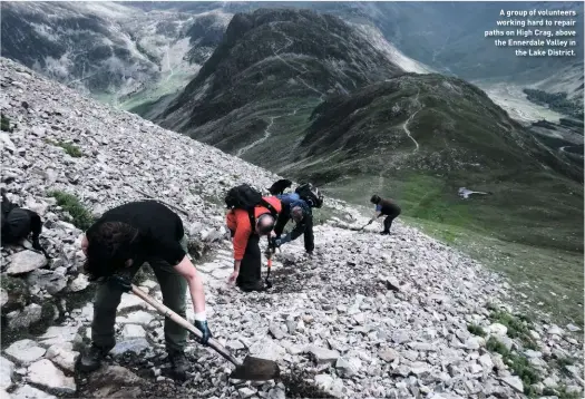  ??  ?? A group of volunteers working hard to repair paths on High Crag, above the Ennerdale Valley in the Lake District.