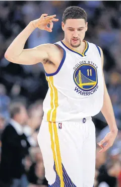  ?? AFP ?? The Warriors’ Klay Thompson reacts after making a three-point shot against the Suns.