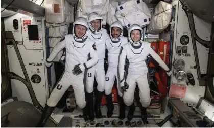  ?? Photograph: Nasa/AP ?? European Space Agency astronaut Matthias Maurer and Nasa astronauts Tom Marshburn, Raja Chari and Kayla Barron pose during a fit check onboard the Internatio­nal Space Station's Harmony module.