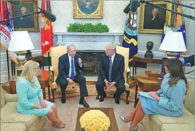  ?? MANDEL NGAN / AGENCE FRANCE-PRESSE ?? US President Donald Trump meets with Israeli Prime Minister Benjamin Netanyahu as his wife Sara (left) and First Lady Melania Trump look on at the White House on Monday in Washington.