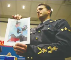  ?? JASON PAYNE ?? North Vancouver RCMP Sgt. Peter Devries displays a photo of a 13-year-old boy who was struck with a ski pole while skiing down The Cut at Grouse Mountain March 30. The pole punctured the teen’s skull.