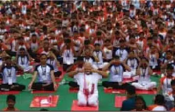  ??  ?? Prime Minister Narendra Modi (middle) takes part in the Yoga Day celebratio­ns in Lucknow on June 21, 2017.