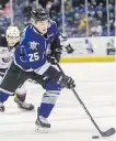  ??  ?? Royals’ Dino Kambeitz carries the puck past Vancouver Giants’ Dylan Plouffe in WHL action at Save-on-Foods Memorial Centre on Saturday.