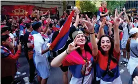  ?? ?? Jubilant: Fans outside the hotel where Djokovic was held