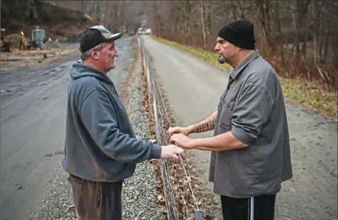  ?? Alexandra Wimley/Post-Gazette ?? Charles Prodanovic­h of Trafford stops to talk with Lt. Gov.-elect John Fetterman after recognizin­g him while Mr. Fetterman was on a walk with his family Tuesday on the Westmorela­nd Heritage Trail.