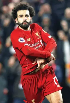  ?? Picture: Reuters ?? SHEER CLASS. Liverpool’s Mohamed Salah takes his shirt off as he celebrates scoring their second goal against Manchester United in their English Premier League clash at Anfield on Sunday.