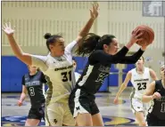  ?? AUSTIN HERTZOG - MEDIANEWS GROUP ?? Methacton’s Nicole Timko brings down a rebound in front of Spring-Ford’s Mac Pettinelli.