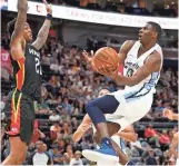  ?? RICK ?? Memphis Grizzlies forward Jaren Jackson Jr. (13) goes to the basket as Atlanta Hawks' forward John Collins defends during a summer league game on July 2. BOWMER/AP