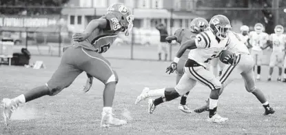  ?? KIM HAIRSTON/BALTIMORE SUN ?? Towson’s Rodger Holcombe heads to the end zone on a touchdown run against Patapsco in the Ravens RISE High School Football Showdown. Holcombe rushed for another score and finished with 72 yards as the Generals earned their third win in four games.