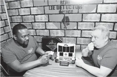  ?? CHARLES SYKES/AP ?? Demonstrat­ors at Hasbro play a prototype of a lie detector game at a 2018 toy fair in New York.