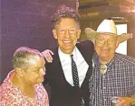  ?? COURTESY IMAGE ?? Bonnie Hearne, left, pictured with country music artist Lyle Lovett and her husband, Bill Hearne, at The Santa Fe Opera. Bonnie Hearne died Tuesday at age 71.