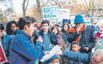  ?? JAMES FOSTER/FOR THE SUN-TIMES ?? Sophomore Camilo Medina speaks at the Unite Against Hate March organized by students of Oak Park and River Forest High School on Sunday.