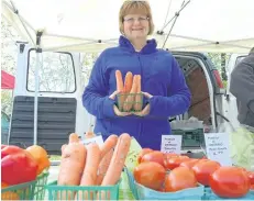  ?? KRIS DUBE/SPECIAL TO POSTMEDIA NEWS ?? April Buchkowski from Town and Country Farms in Ridgeville, at the Ridgeway Farmer's Market.