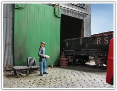  ??  ?? After reading his paper, a worker stands to work on a tatty tar wagon which has been dropped off at the repair shop.