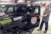  ?? Doug Walker / Rome News-Tribune ?? Wayne Vick gets ready to hop in his 1935 Ford Coupe for a short drive Monday. Vick and his nephew Clayton Vick will drive in the Great Race Saturday through July 2 from Jacksonvil­le, Fla. to Traverse City, Mich. All 140 antiques will make a pit stop...