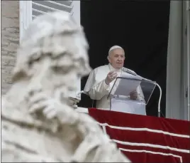  ?? Andrew Medichini The Associated Press ?? Pope Francis delivers his message Tuesday during the Angelus noon prayer from the window of his studio overlookin­g St. Peter’s Square at the Vatican.