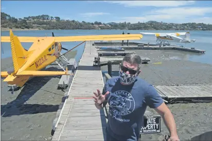  ?? PHOTOS BY ALAN DEP — MARIN INDEPENDEN­T JOURNAL ?? Aaron Singer, owner of Seaplane Adventures, runs the business from the shore of Richardson Bay. The county says the company is not an essential flight operation allowed to run during the pandemic.