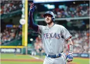  ?? Brett Coomer/Staff photograph­er ?? Jonah Heim’s home run Monday against the Astros helped the Rangers improve to 7-0 in the postseason.