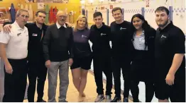  ??  ?? Roy Griffiths with the lifeguards and staff at Morriston Leisure Centre.