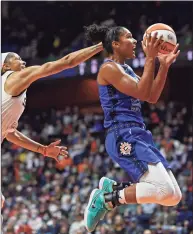  ?? Sean D. Elliot / Associated Press ?? Connecticu­t Sun forward Alyssa Thomas drives by Chicago Sky center Candace Parker during their playoff game Thursday at Mohegan Sun Arena in Uncasville.