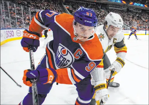  ?? ?? Oilers center Connor Mcdavid, left, and Knights right wing Mark Stone vie for the puck in the first period. “It’s tough when the best player in the league makes a play to win it,” Stone said afterward of Mcdavid.