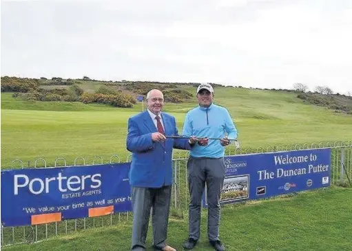  ??  ?? Charlie Strickland receives the Duncan Putter last April from Southerndo­wn captain Paul Porter