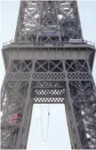  ?? — AFP ?? Anouk Garnier climbs up the Eiffel Tower.