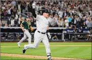  ?? CHANG W. LEE / THE NEW YORK TIMES ?? The Yankees’ Luke Voit, a July trade acquisitio­n, hit 14 homers down the stretch and a two-run triple (above) in a wild-card win over the A’s.