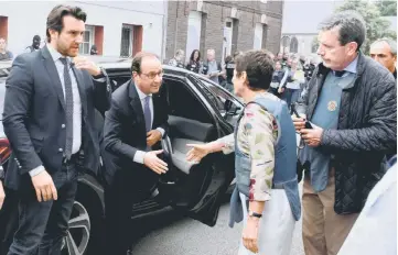  ?? — Reuters photo ?? French President Francois Hollande (centre) arrives after a hostage-taking at a church in Saint-Etienne-du-Rouvray, France.