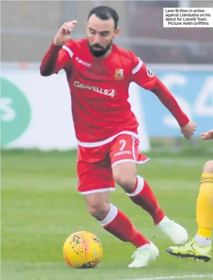  ??  ?? Leon Britton in action against Llandudno on his debut for Llanelli Town.Picture: Keith Griffiths