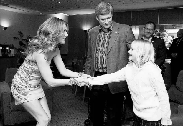  ?? Jason Ransom / PMO ?? Prime Minister Stephen Harper and his daughter Rachel meet Celine Dion backstage in Montreal in 2009. So-called gut voters plump for Justin Trudeau because they “know” he is inspiring, or for Harper because they feel he is trustworth­y, or for Thomas...