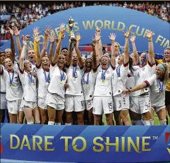  ?? ALESSANDRA TARANTINO / AP ?? The United States’ team celebrates winning the Women’s World Cup on July 7. The women have won back-to-back titles while the men’s team did not make the field for the 2018 World Cup in Russia.
