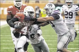  ?? DEBORAH CANNON / AMERICAN-STATESMAN ?? Daje Johnson and the Longhorns pushed back on Kansas State in Saturday’s 23-9 Big 12 victory in Austin.