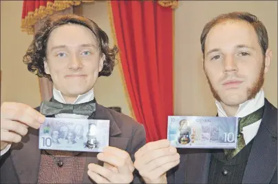  ?? DAVE STEWART/THE GUARDIAN ?? Sir John A. Macdonald, left, and Sir George-Étienne Cartier, two of the Fathers of Confederat­ion as played by the Confederat­ion Players, display the new $10 bank note unveiled in Charlottet­own on Monday. It commemorat­es Canada’s 150th birthday.