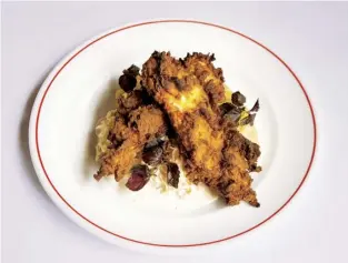  ??  ?? Below Martha’s fried chicken with mash, apple slaw and honey-truffle sauce