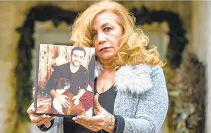  ?? APRIL GAMIZ/THE MORNING CALL ?? Dolores “Dee” Zerfass lost her 28-year-old son, Zachary Zerfass, to a drug overdose on June 14, 2020. Here she holds a picture of him. Zachary was one of hundreds of people who died of drug overdoses in the Lehigh Valley region during the first half of 2020.