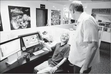  ?? Kirk McKoy
Los Angeles Times ?? PAUL DEMEYER,
left, confers with director Michael Daedalus Kenny about “Miles From Tomorrowla­nd.”