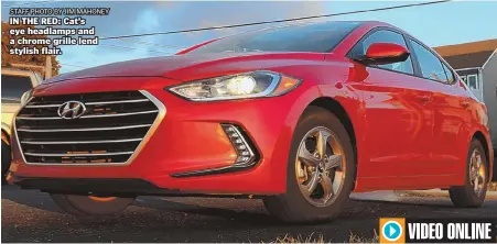  ?? STAFF PHOTO BY JIM MAHONEY ?? IN THE RED: Cat’s eye headlamps and a chrome grille lend stylish flair.