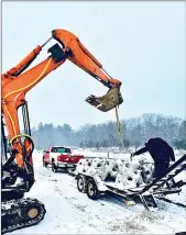  ?? Photo submitted ?? A machine was used to place the 500 pound stones on the floor of the Kinzua Reservoir.