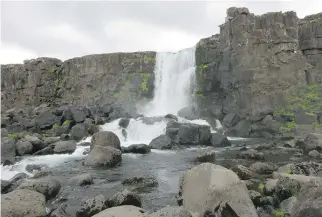  ?? MARY WINSTON NICKLIN/WASHINGTON POST ?? A waterfall in Thingvelli­r National Park in southweste­rn Iceland, designated a UNESCO World Heritage site for its role in how ancient Viking society organized itself.